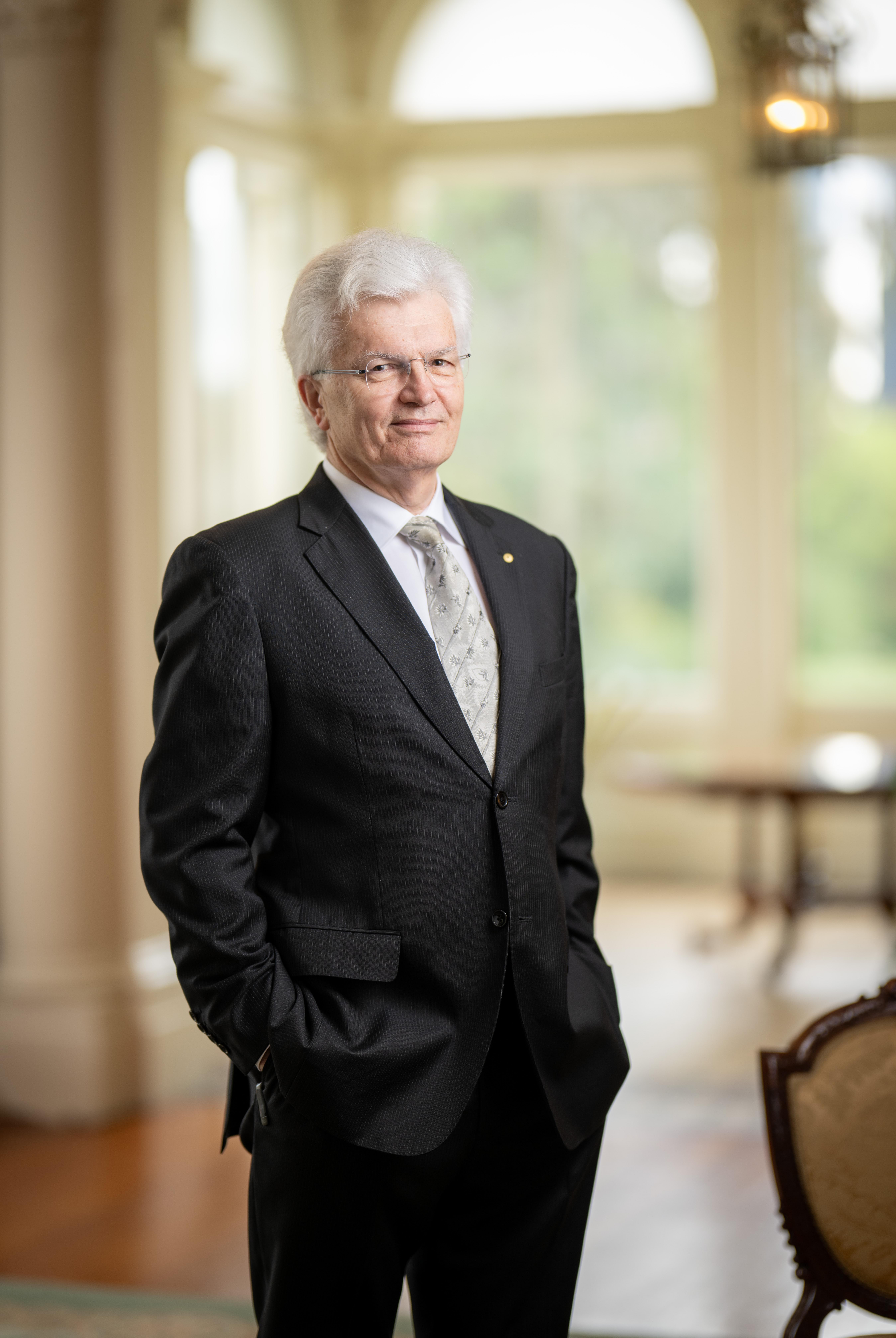 Professor Glyn Davis AC standing in the State Drawing Room at Government House Victoria