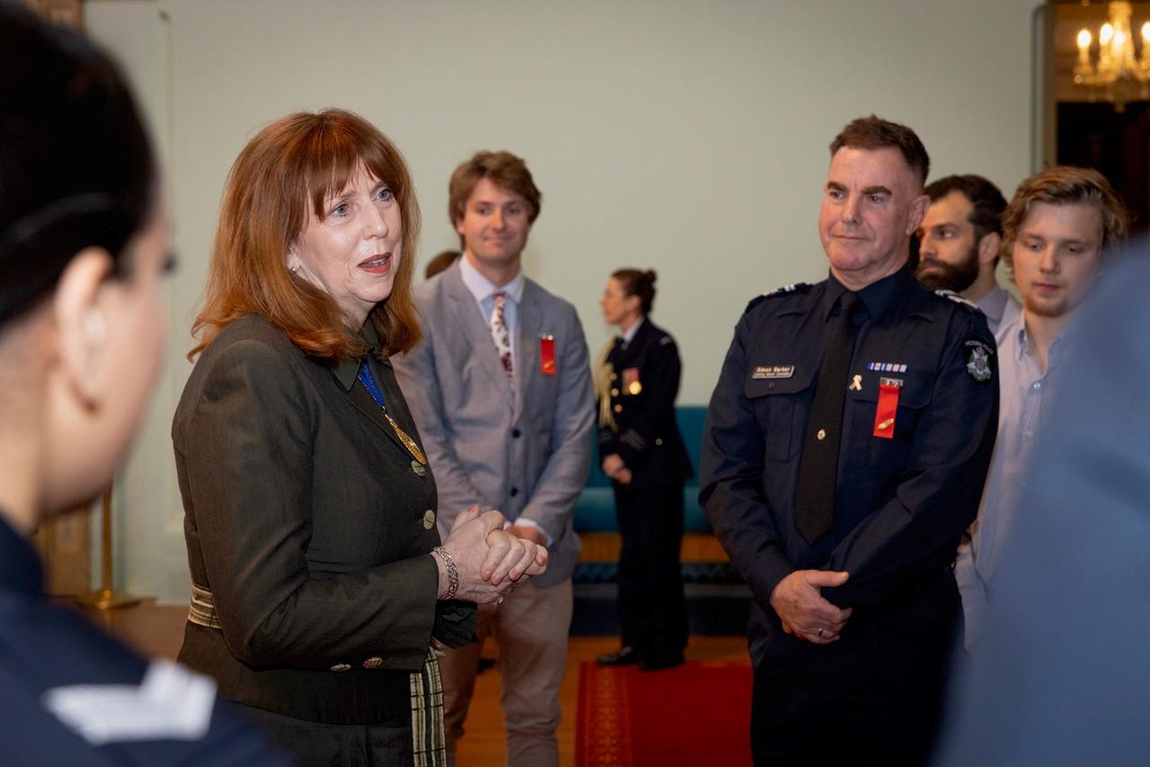 Her Excellency Professor the Honourable Margaret Gardner AC speaking with recipients at an investiture of Australian Bravery Decorations held at Government House