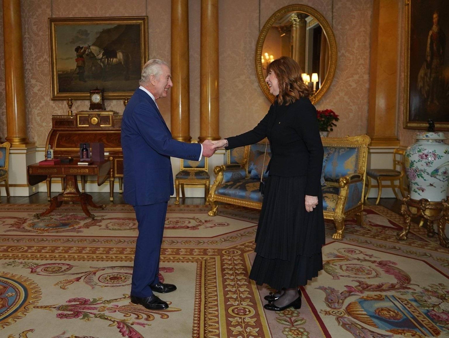 Her Excellency Professor the Honourable Margaret Gardner AC shaking hands with His Majesty King Charles III